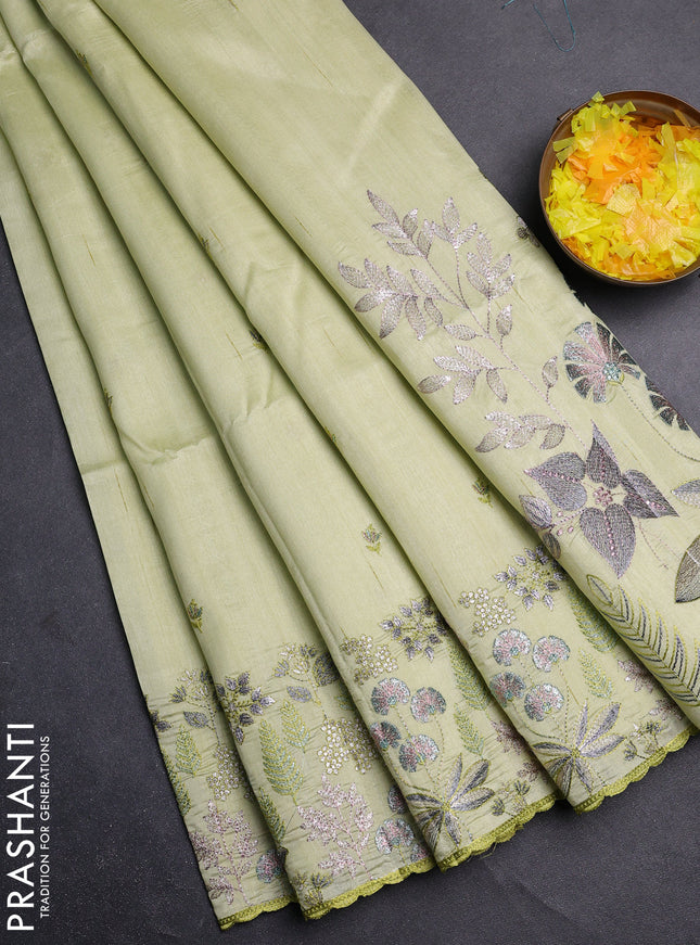 Semi raw silk saree pista green with embroidery buttas and embroidery border