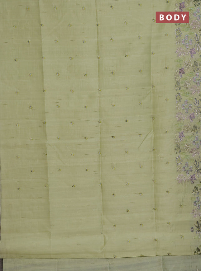 Semi raw silk saree pista green with embroidery buttas and embroidery border