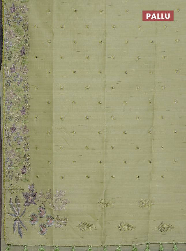 Semi raw silk saree pista green with embroidery buttas and embroidery border
