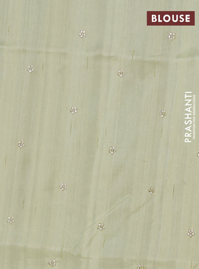 Semi raw silk saree pista green with embroidery buttas and embroidery border