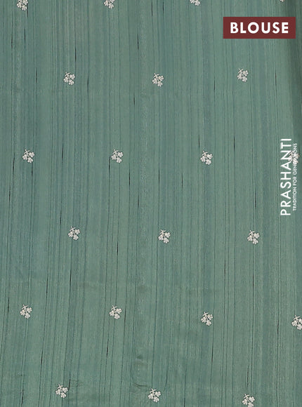 Semi raw silk saree green shade with embroidery buttas and floral embroidery border