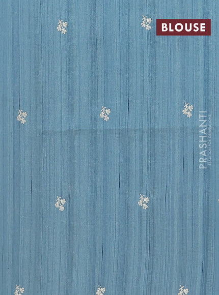 Semi raw silk saree pastel blue shade with embroidery buttas and floral embroidery border
