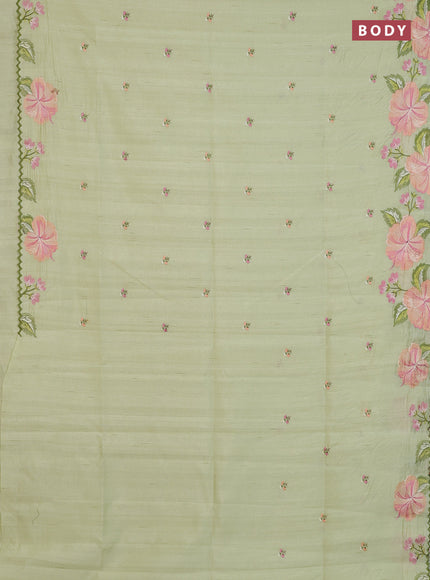 Semi raw silk saree pista green with embroidery buttas and floral embroidery border