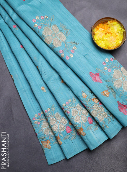 Semi raw silk saree teal blue with embroidery buttas and floral embroidery border