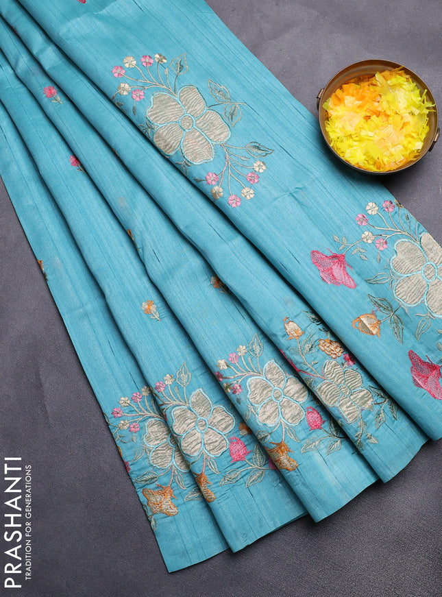 Semi raw silk saree teal blue with embroidery buttas and floral embroidery border