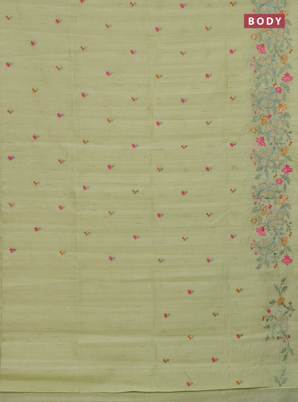 Semi raw silk saree pista green with embroidery buttas and floral embroidery border