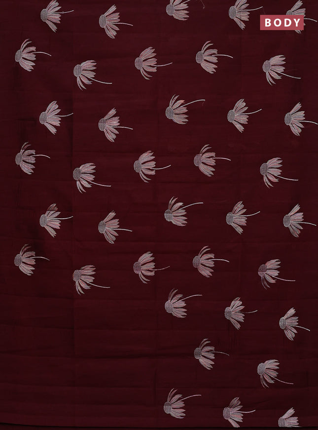 Semi raw silk saree deep maroon with floral embroidery work buttas in borderless style