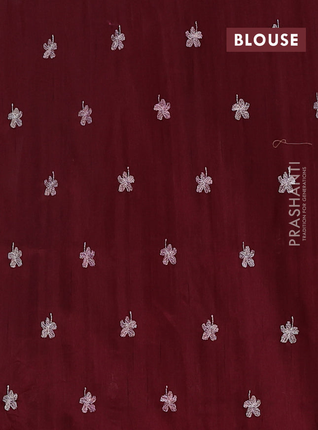 Semi raw silk saree deep maroon with floral embroidery work buttas in borderless style