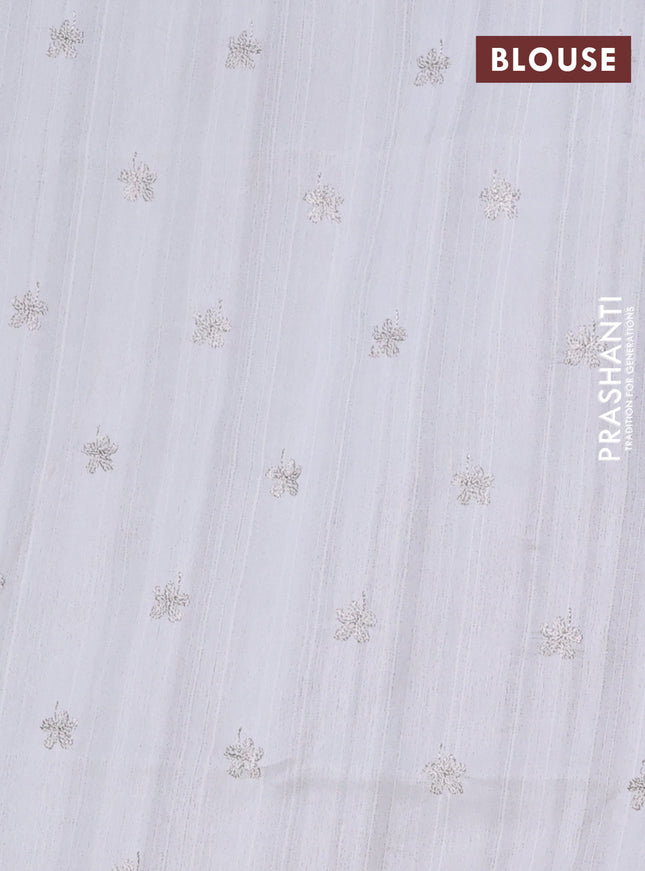 Semi raw silk saree off white with floral embroidery work buttas in borderless style