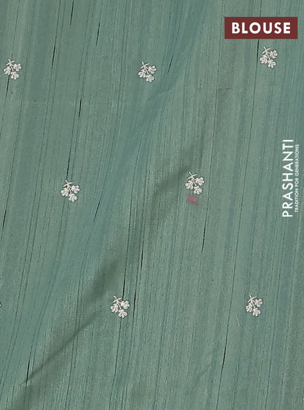 Semi raw silk saree green shade with embroidery work buttas and floral embroidery border