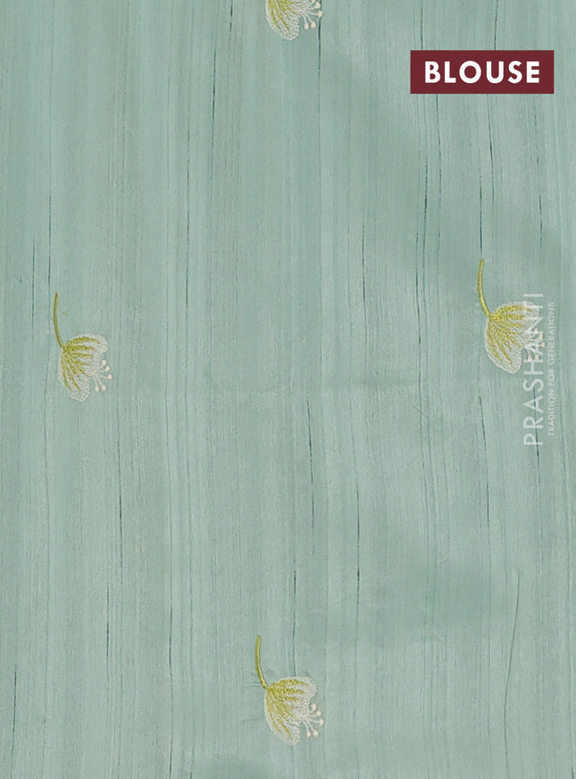 Semi raw silk saree pastel green with embroidery work buttas and floral embroidery border