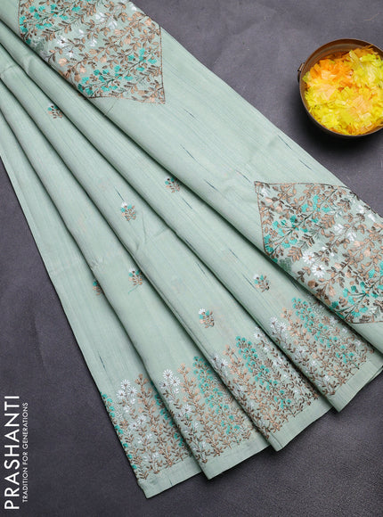 Semi raw silk saree pastel green with floral embroidery work buttas and embroidery border