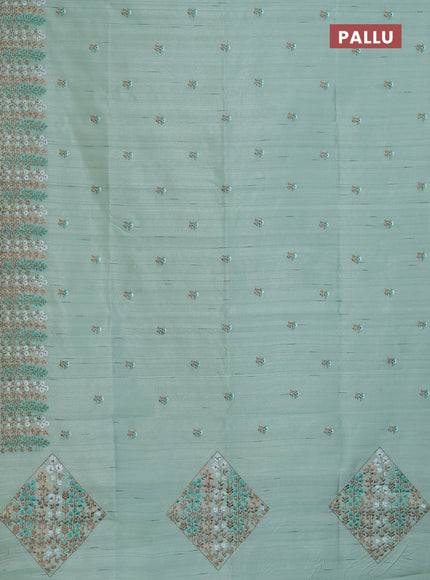 Semi raw silk saree pastel green with floral embroidery work buttas and embroidery border