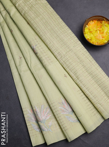 Semi raw silk saree pista green with embroidery buttas and embroidery butta border