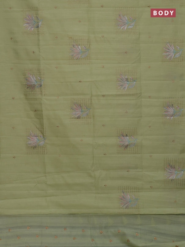 Semi raw silk saree pista green with embroidery buttas and embroidery butta border