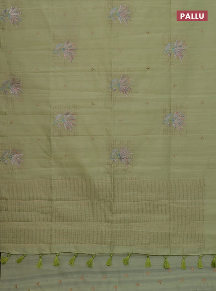 Semi raw silk saree pista green with embroidery buttas and embroidery butta border