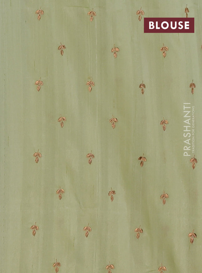 Semi raw silk saree pista green with embroidery buttas and embroidery butta border