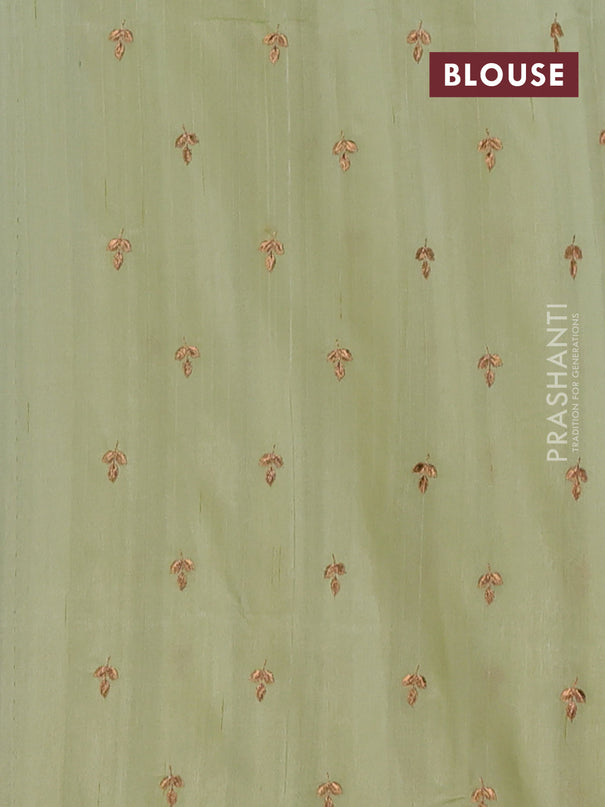 Semi raw silk saree pista green with embroidery buttas and embroidery butta border