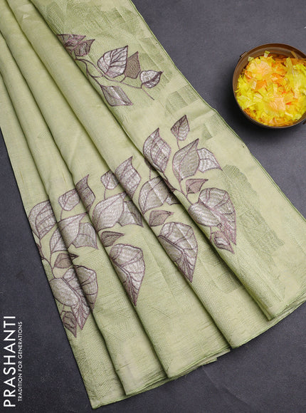 Semi raw silk saree pista green with embroidery buttas and long embroidery border