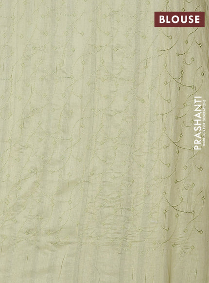 Semi raw silk saree pista green with embroidery buttas and long embroidery border