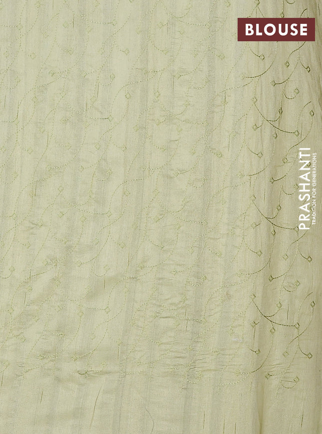 Semi raw silk saree pista green with embroidery buttas and long embroidery border