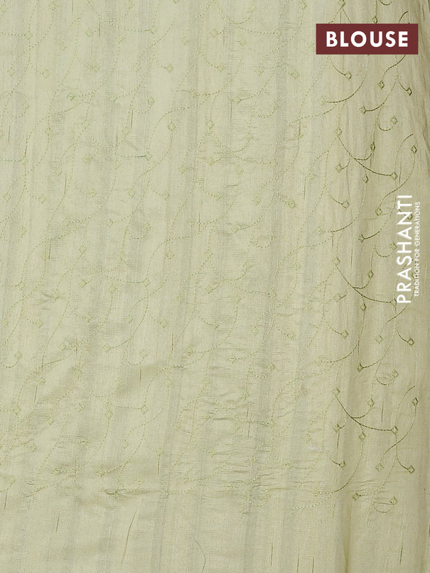 Semi raw silk saree pista green with embroidery buttas and long embroidery border