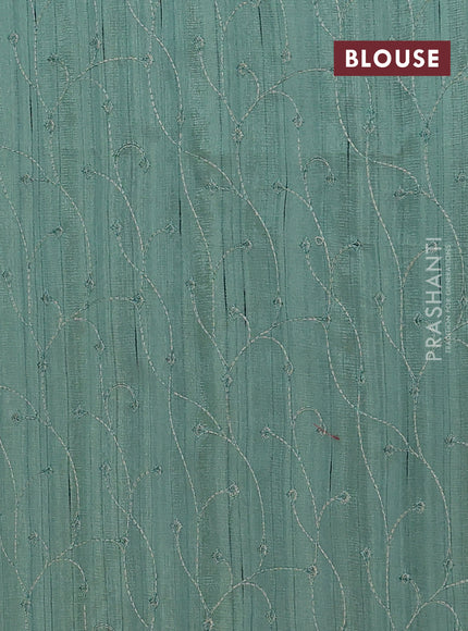 Semi raw silk saree green shade with embroidery buttas and long embroidery border