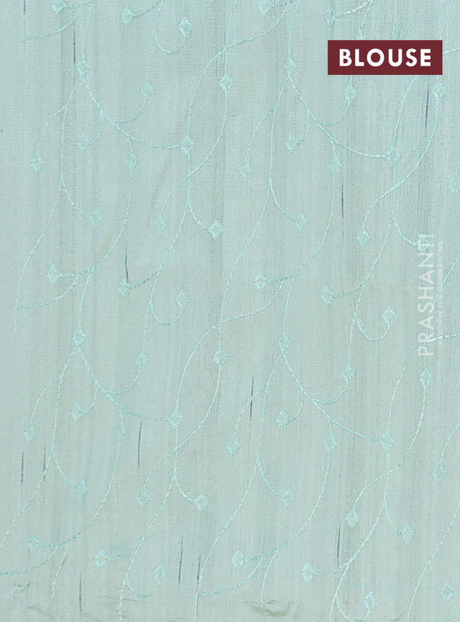 Semi raw silk saree pastel green with embroidery buttas and long embroidery border