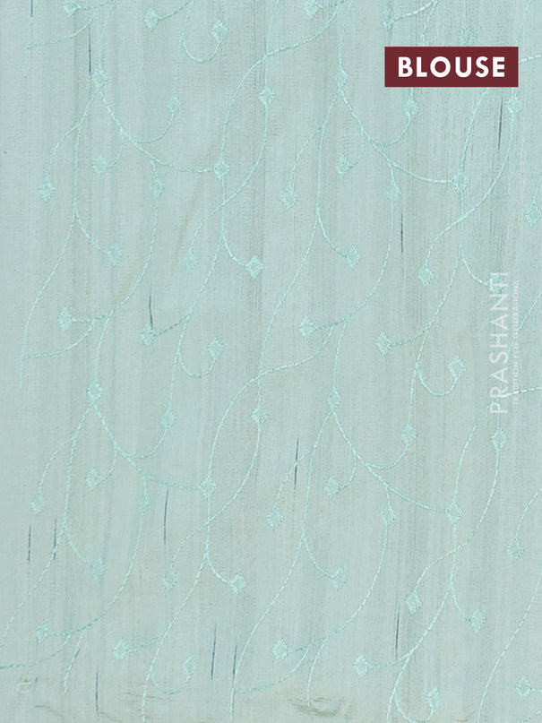 Semi raw silk saree pastel green with embroidery buttas and long embroidery border