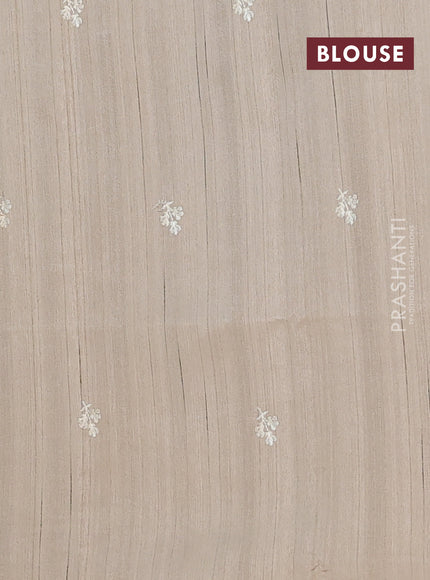Semi raw silk saree beige with embroidery buttas and floral embroidery border