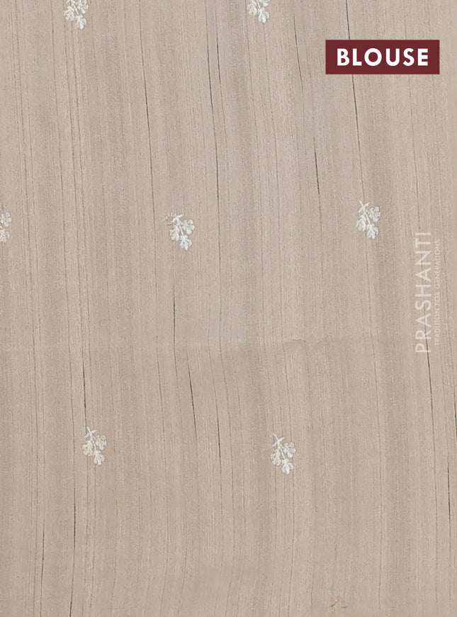 Semi raw silk saree beige with embroidery buttas and floral embroidery border
