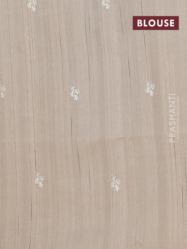 Semi raw silk saree beige with embroidery buttas and floral embroidery border