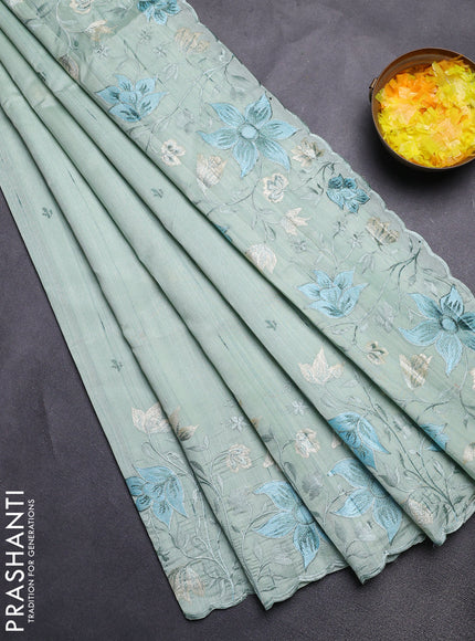 Semi raw silk saree pastel green with embroidery buttas and floral embroidery border