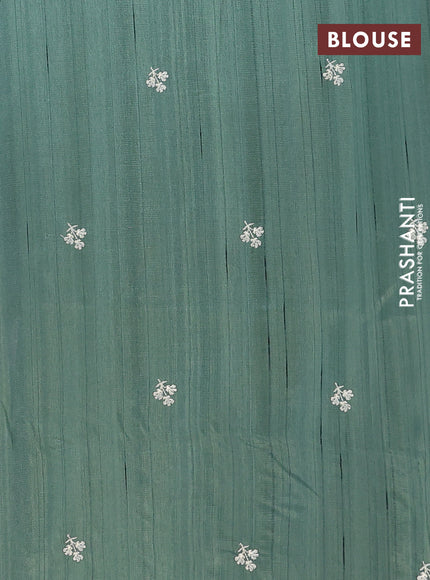 Semi raw silk saree green with embroidery buttas and floral embroidery border