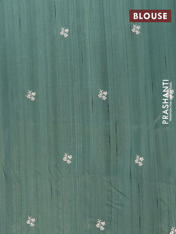 Semi raw silk saree green with embroidery buttas and floral embroidery border