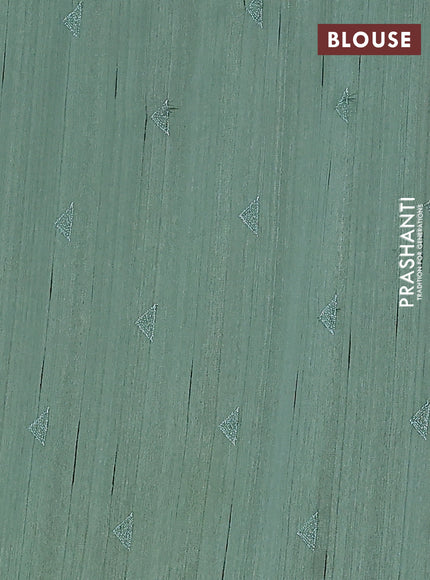 Semi raw silk saree green with embroidery buttas and long embroidery border