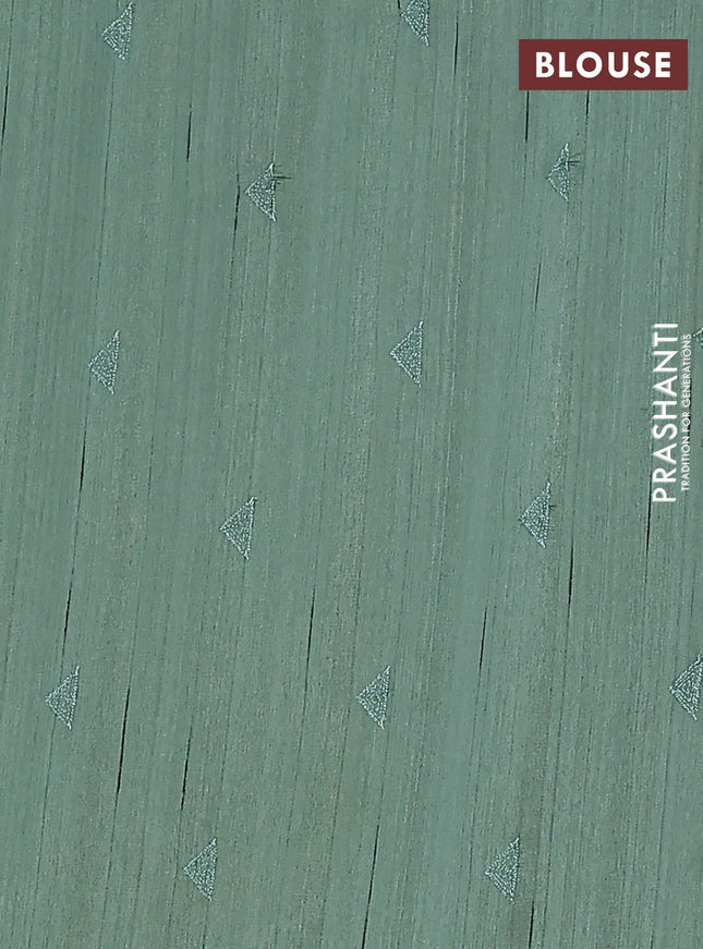 Semi raw silk saree green with embroidery buttas and long embroidery border