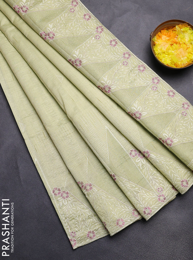 Semi raw silk saree pista green with embroidery buttas and long embroidery border