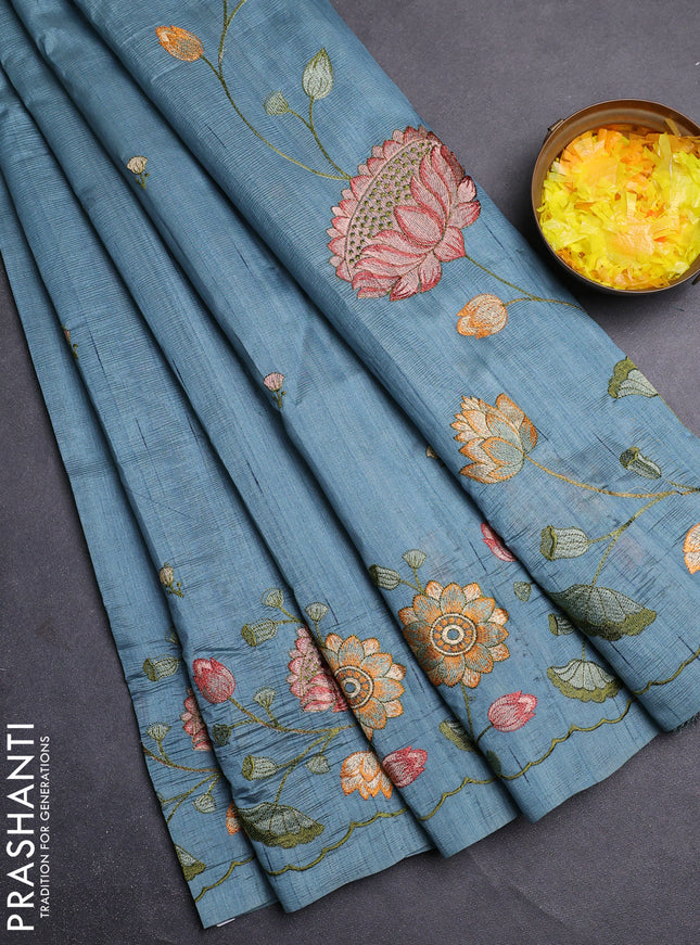 Semi raw silk saree pastel blue shade with embroidery buttas and floral embroidery border