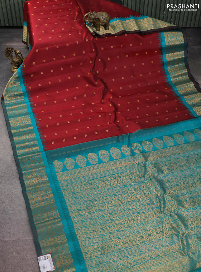 Pure gadwal silk saree maroon and peacock green with zari woven buttas and temple design zari woven border