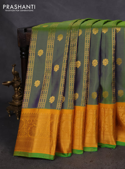 Pure gadwal silk saree dual shade of bluish green and yellow with allover zari weaves & buttas and zari woven border