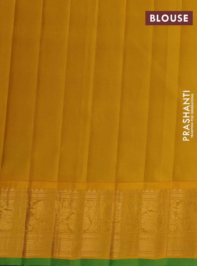 Pure gadwal silk saree dual shade of bluish green and yellow with allover zari weaves & buttas and zari woven border