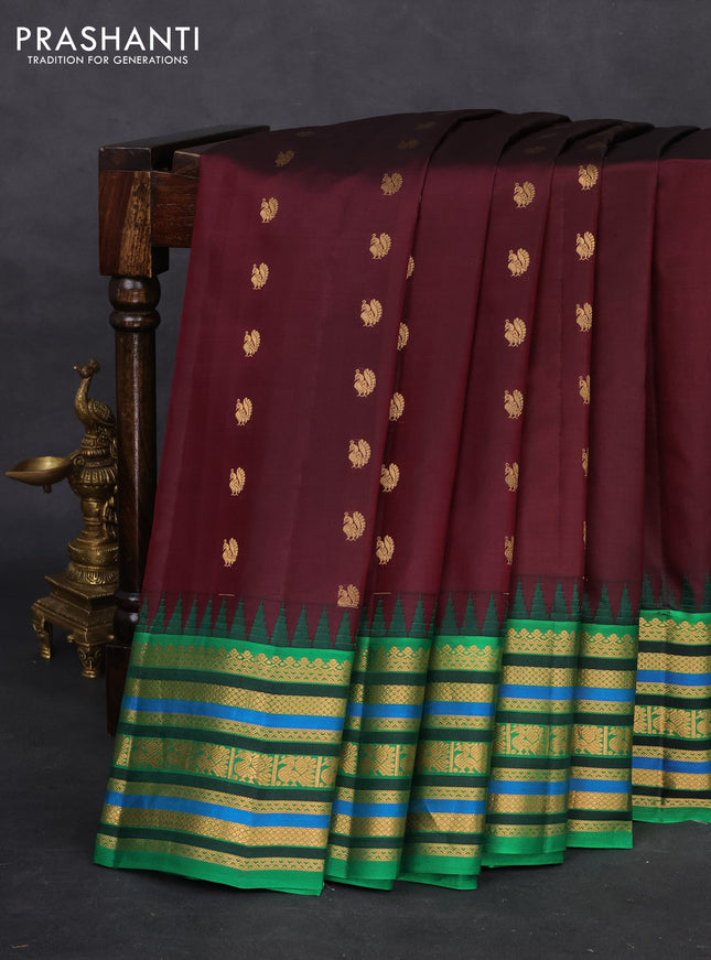 Pure gadwal silk saree deep wine shade and green with annam zari woven buttas and temple design zari woven border