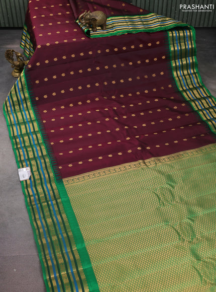 Pure gadwal silk saree deep wine shade and green with annam zari woven buttas and temple design zari woven border