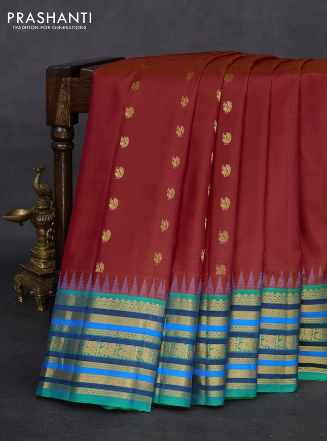 Pure gadwal silk saree red and dual shade of teal green with annam zari woven buttas and temple design zari woven border