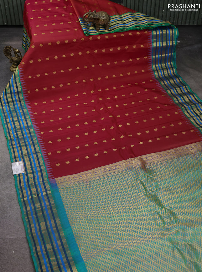 Pure gadwal silk saree red and dual shade of teal green with annam zari woven buttas and temple design zari woven border