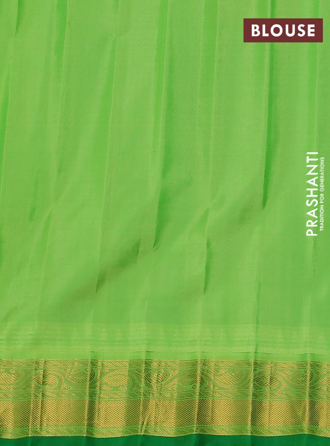 Pure gadwal silk saree orange and light green with zari woven buttas and temple design zari woven border