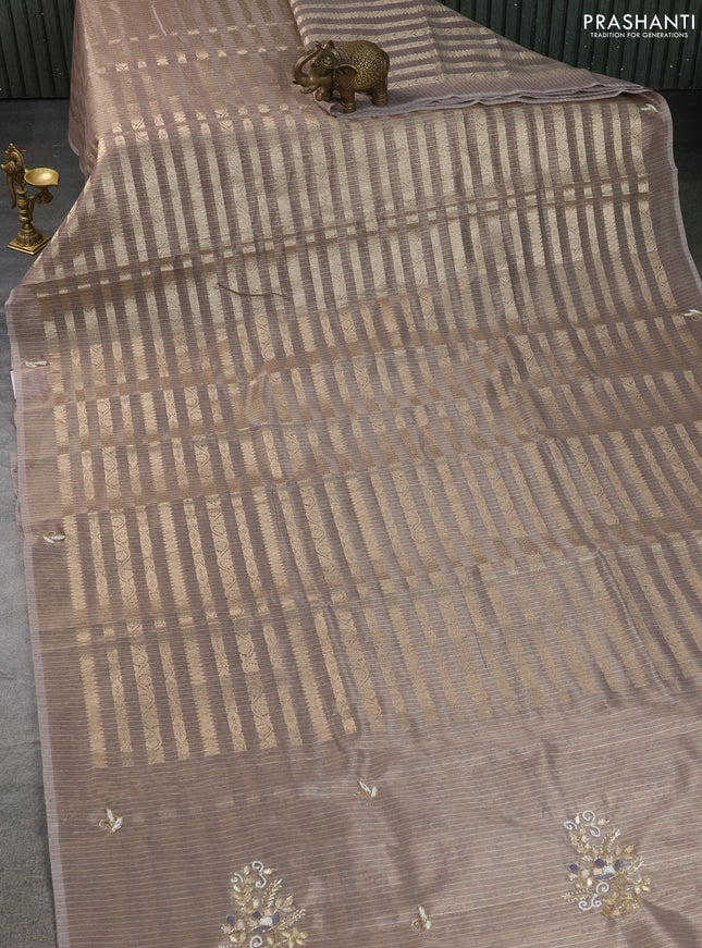 Kota tissue saree pastel brown with allover zari weaves and embroidery butta border