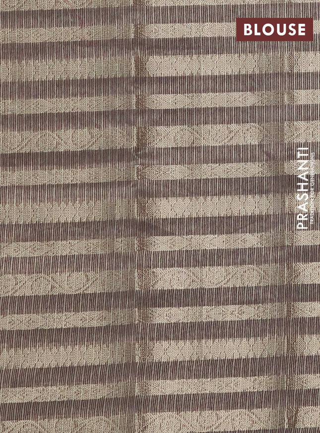 Kota tissue saree pastel brown with allover zari weaves and embroidery butta border