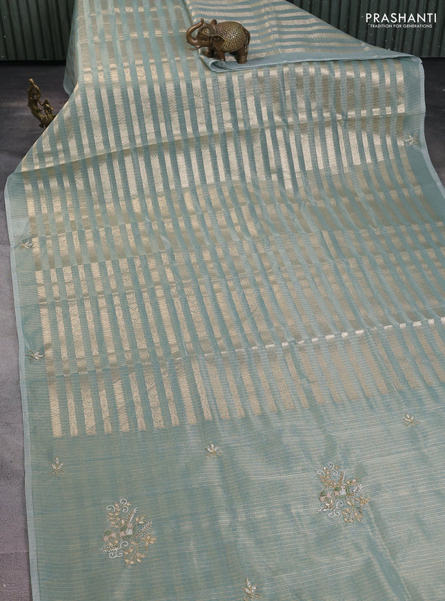 Kota tissue saree teal green with allover zari weaves and embroidery butta border